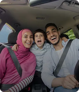 Happy Muslim family with their car using halal car finance in the UK